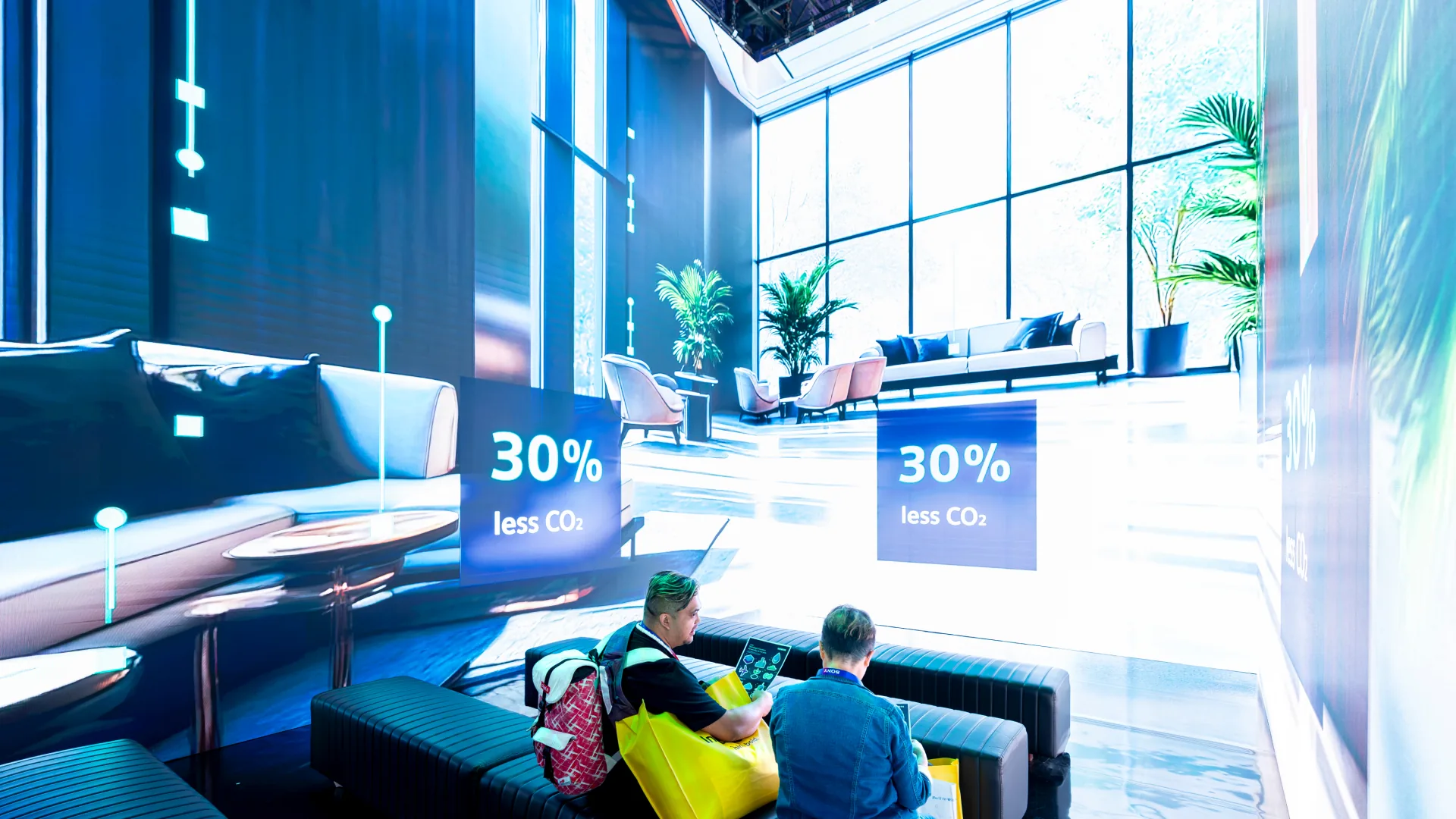 Theater screens show a sunlit living room with 30% less CO2 callouts