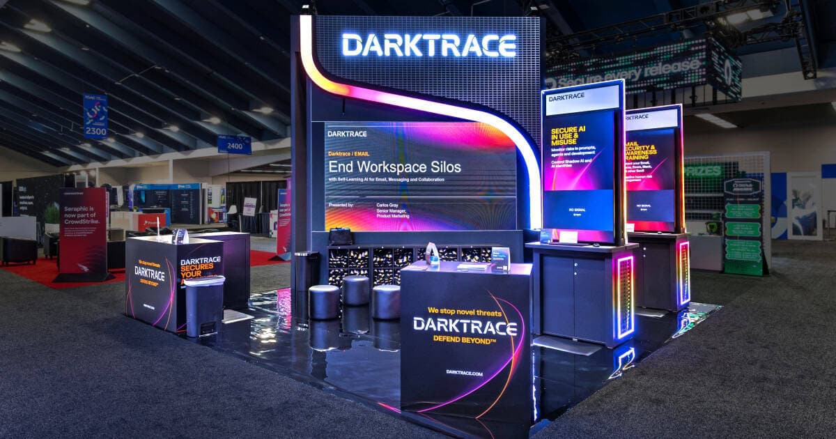 Sparks-designed Darktrace "Defend Beyond" booth at RSAC 2026 — AI-driven threat detection and autonomous response exhibit environment.