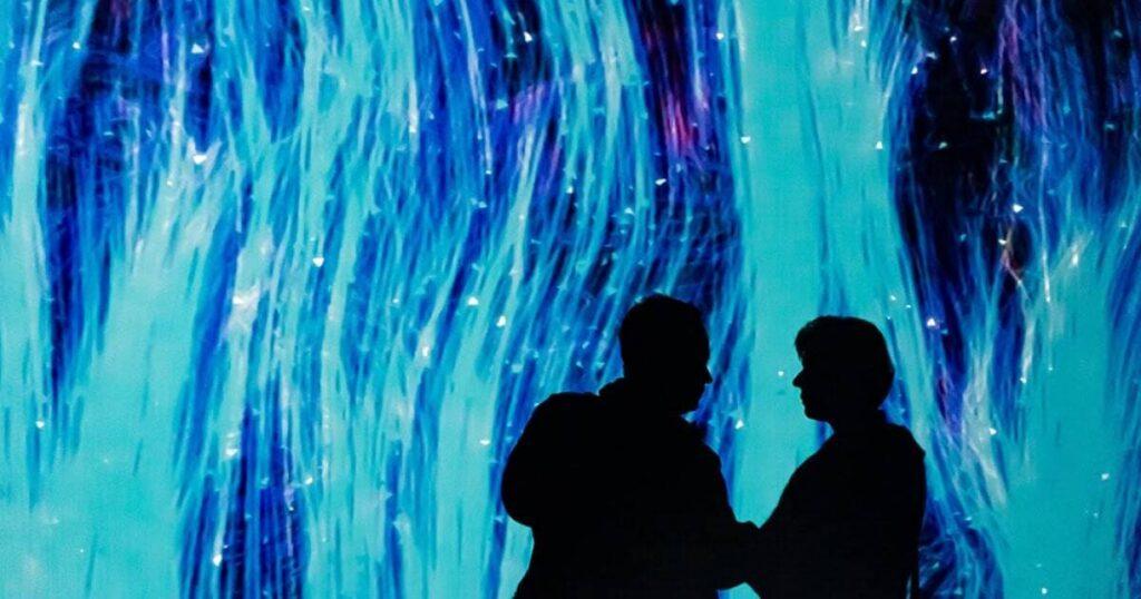 Immersive digital LED environment in a Sparks-designed healthcare exhibit — curved display array carrying a continuous brand narrative for pharma and life sciences audiences.
