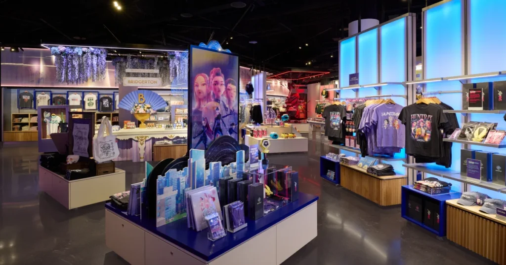 Bridgerton-themed retail area at Netflix House Dallas with wisteria ceiling installation, character signage, and Regency-styled merchandise displays.