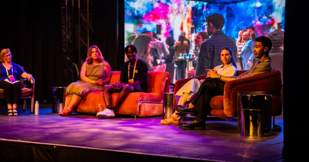 Creative Collision panel at Dreamland during the UK Creative Festival 2026, with moderator Lucy Aitken and panelists Isaac Thomas, Holy Boka, Calypso Newman, and Caroline Sparkes.