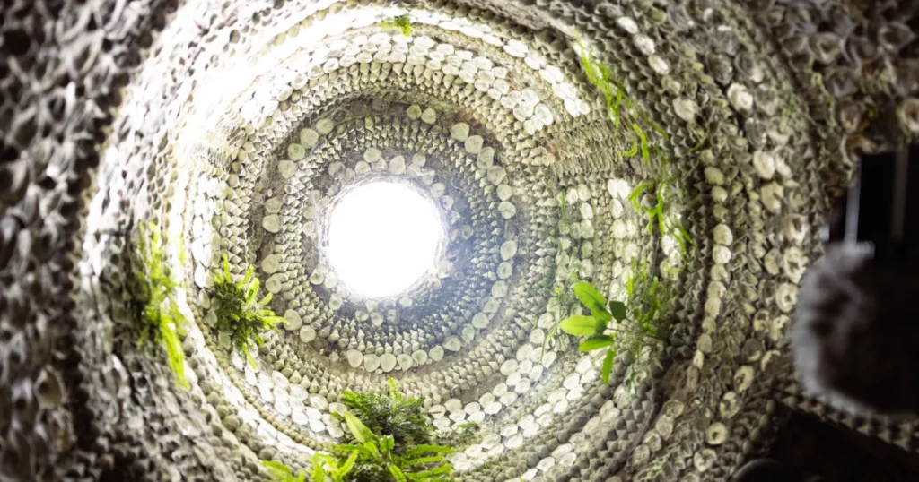 Interior of the Shell Grotto in Margate showing the domed shell-encrusted ceiling opening to daylight, visited by Sparks guests during the UK Creative Festival 2026.