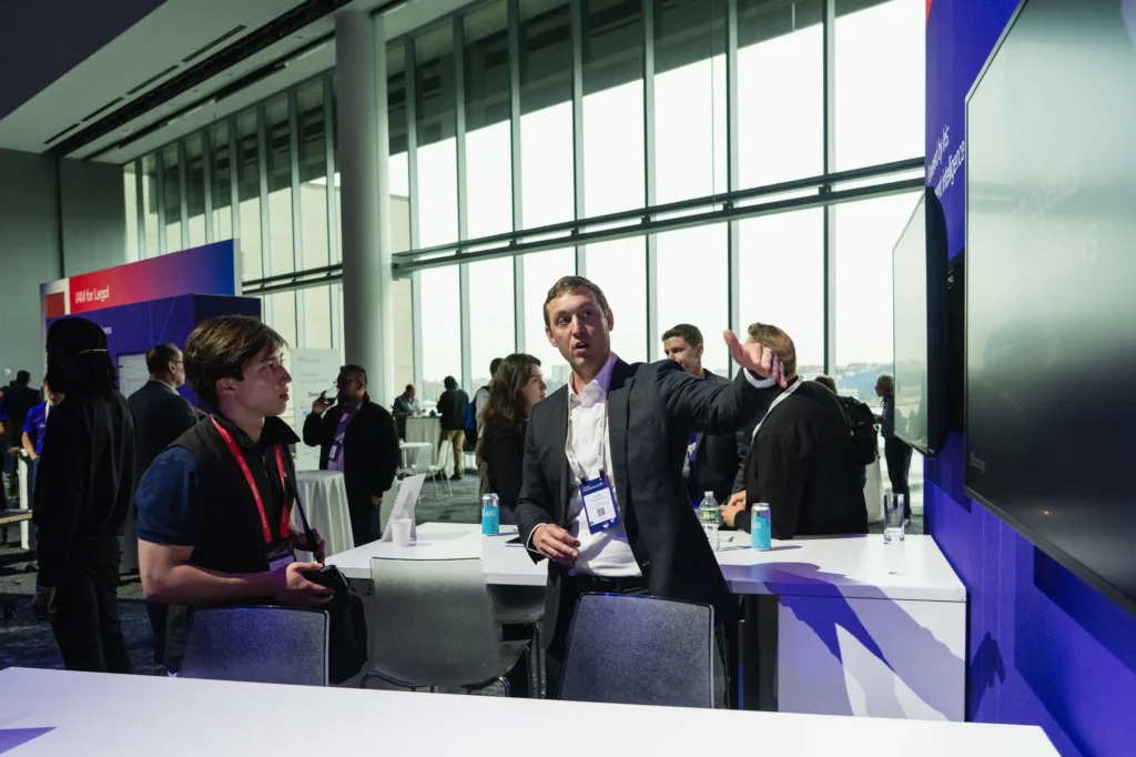 Attendee lounge with Manhattan city views at Sparks-produced Docusign Momentum 2026 — Javits Center's upper-floor programming space on levels four and five of the North Building.