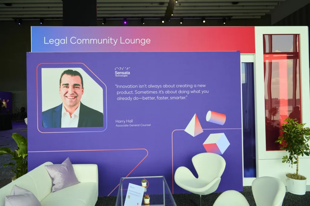 Legal Community Lounge at Docusign Momentum 2026, featuring a customer quote and lounge seating.