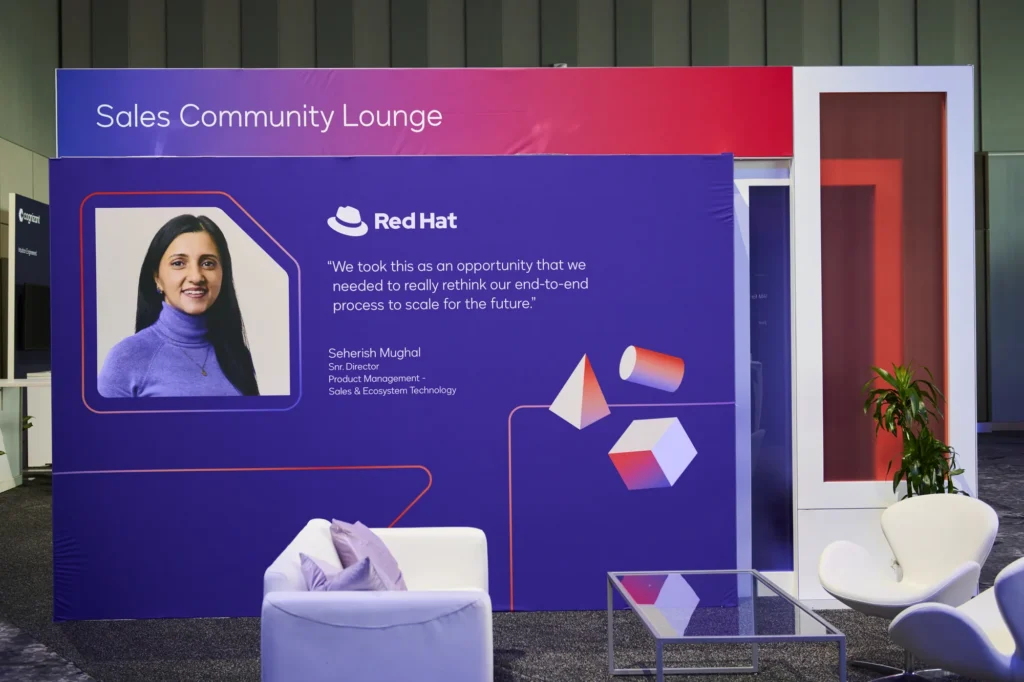 Sales Community Lounge at Docusign Momentum 2026, with a customer quote and lounge seating.