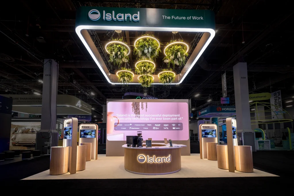 Sparks-designed and built Island 20x30 exhibit at Black Hat 2026 with a suspended plant-and-halo ceiling installation, "The Future of Work" branded header, and Island enterprise browser demo pods at Mandalay Bay Convention Center in Las Vegas.