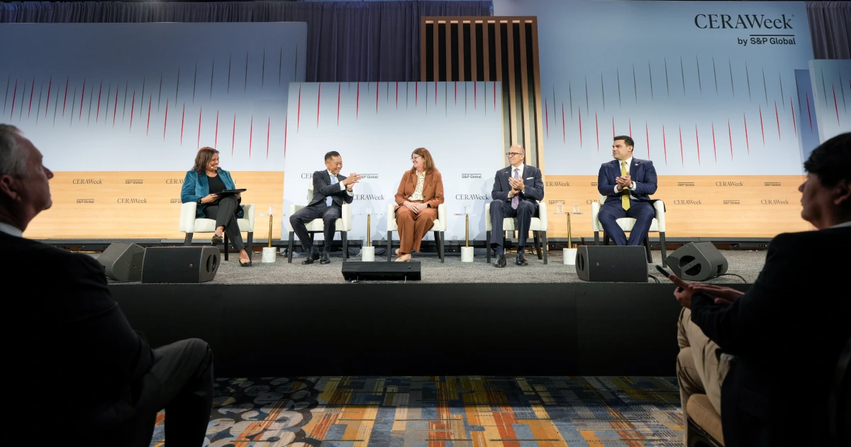 A five-person Executive Conference panel discussion on the Sparks-produced main stage at CERAWeek 2026 by S&P Global — global energy leaders seated in front of the CERAWeek by S&P Global scenic backdrop at the Hilton Americas-Houston in Houston.