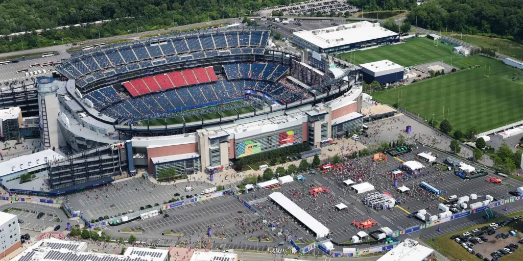 Aerial view of the Sparks-produced Stadium Fan Experience Town Square footprint outside Gillette Stadium in Foxborough at the FIFA World Cup 2026 Boston host city — the full multi-tent activation site Sparks designed and produced for one of seven US host cities.
