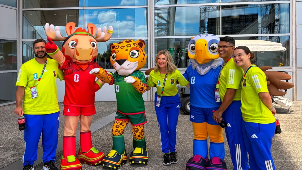 Sparks brand ambassadors pose with the three FIFA World Cup 2026 official mascots — Maple (Canada), Zayu (Mexico), and Clutch (USA) — at the Sparks-produced Stadium Fan Experience Town Square outside AT&T Stadium at the FIFA World Cup 2026 Dallas host city.