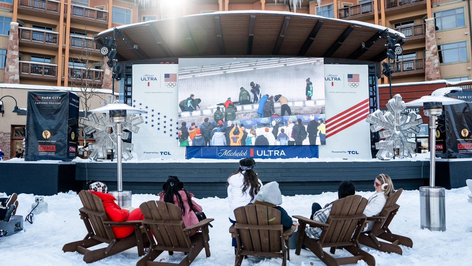Adirondack chairs facing the Michelob ULTRA and Team USA watch-party stage in Park City.
