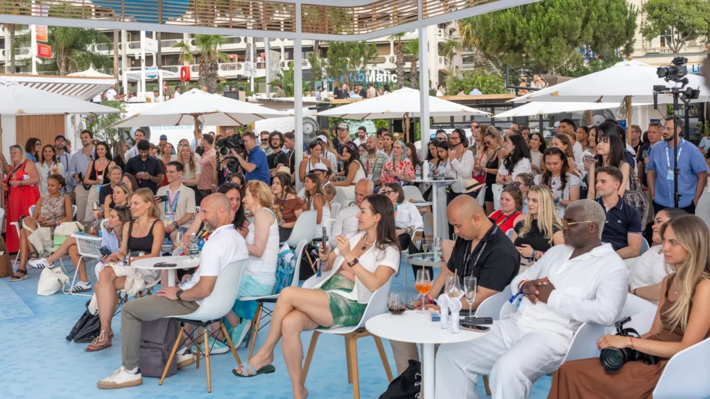 Packed audience watching a panel from the main stage at the Sparks-designed Salesforce Beach pavilion at Cannes Lions 2026 on Annex Beach off La Croisette.