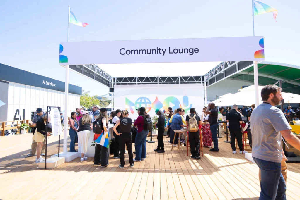 Developers mingle on the wood deck of the Community Lounge between sessions