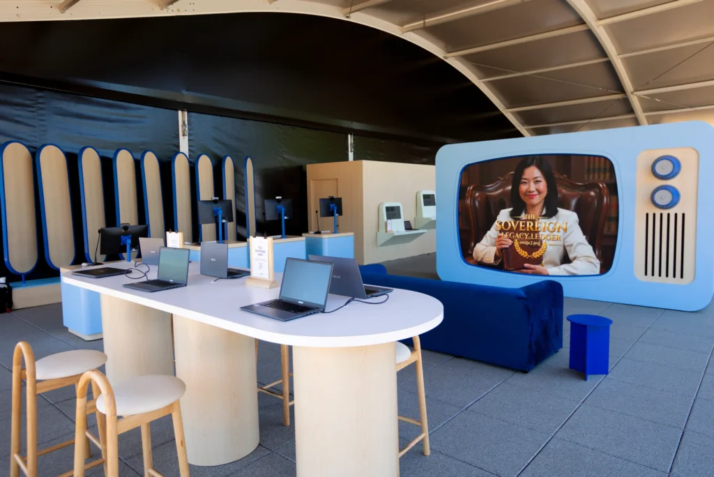 Laptop demo stations, a blue lounge sofa and a retro TV-style display screen