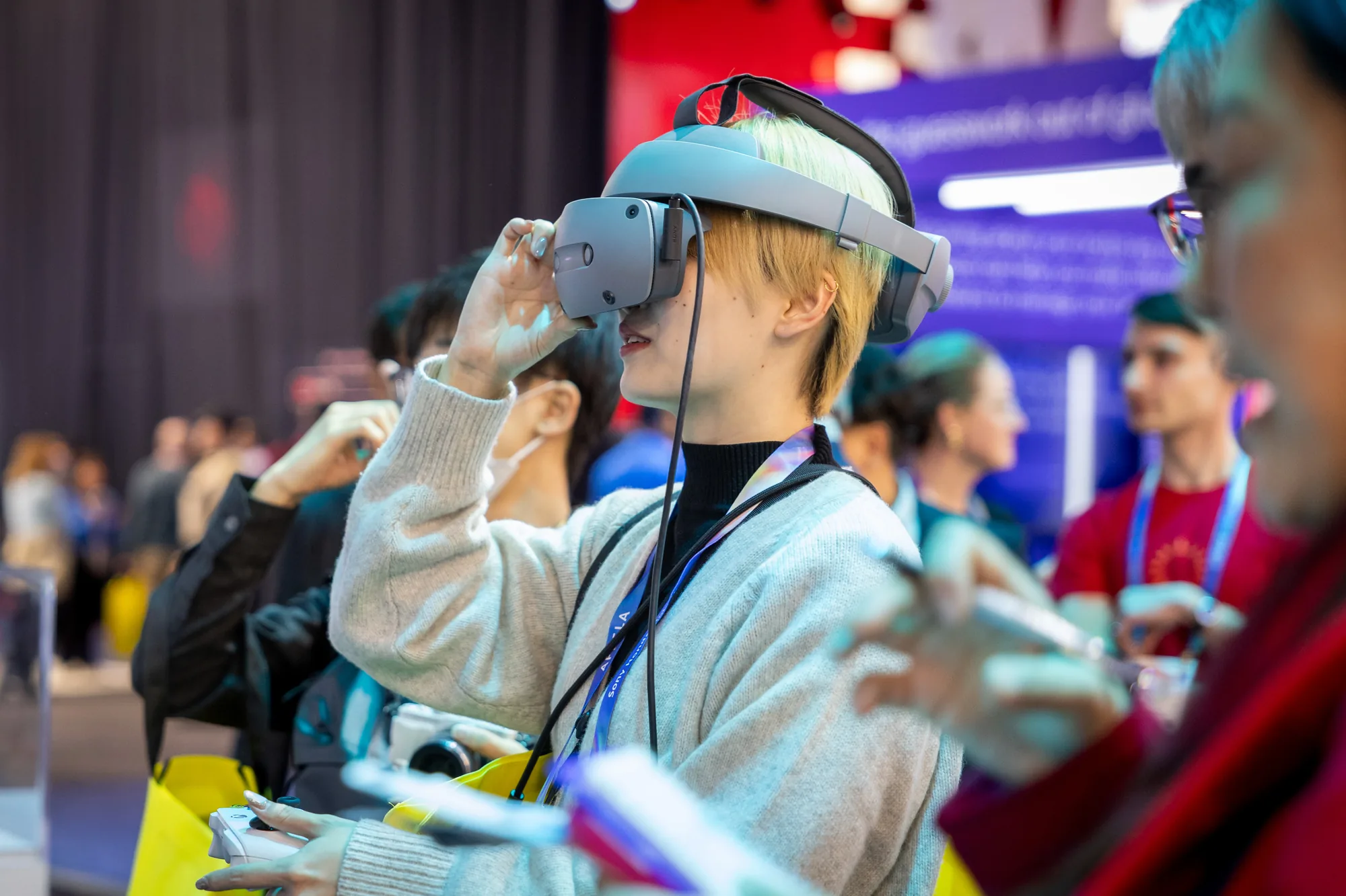CES 2026 attendee trying a mixed reality headset demonstration inside the Siemens exhibit.