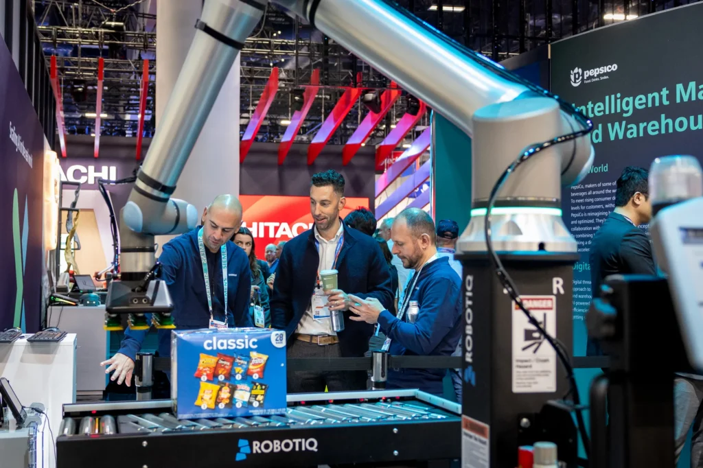 PepsiCo robotic arm demonstration in the "Intelligent Manufacturing and Warehouse" zone of the Siemens CES 2026 exhibit.