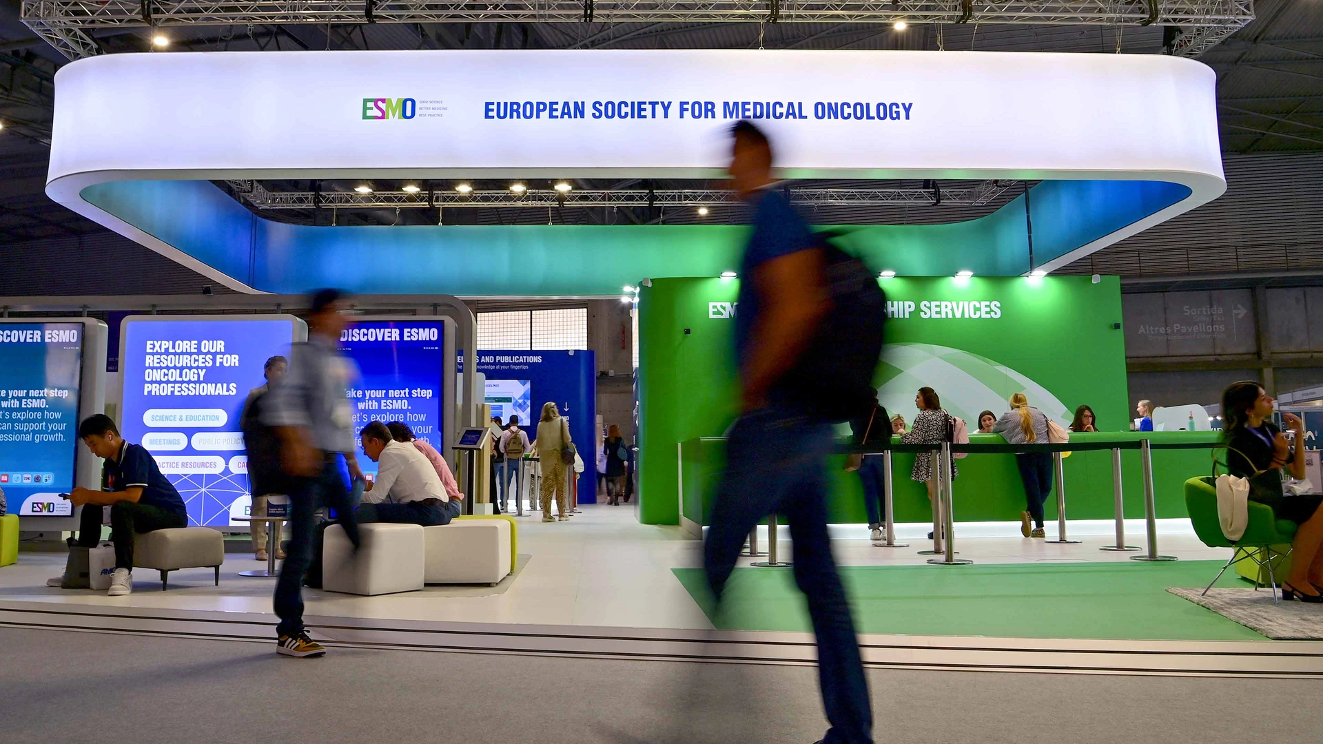 ASCO’s Breakthroughs, ESMO’s Debates, and the Exhibit Halls Between Them