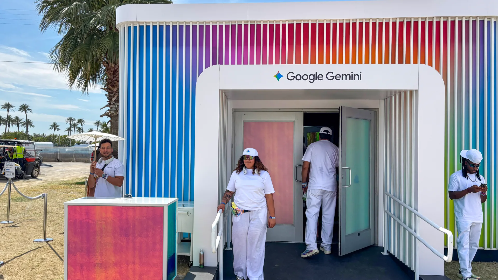 Brand ambassadors in white caps greet guests at the Google Gemini entrance doors