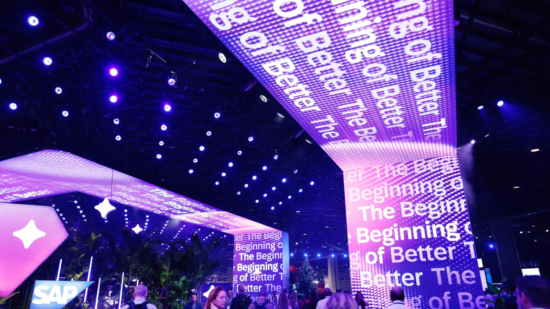 Sparks-designed LED column carrying The Beginning of Better text from canopy to floor