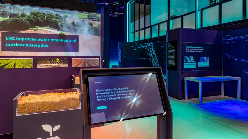 Kiosk and glass soil case in front of a screen about LNC water retention